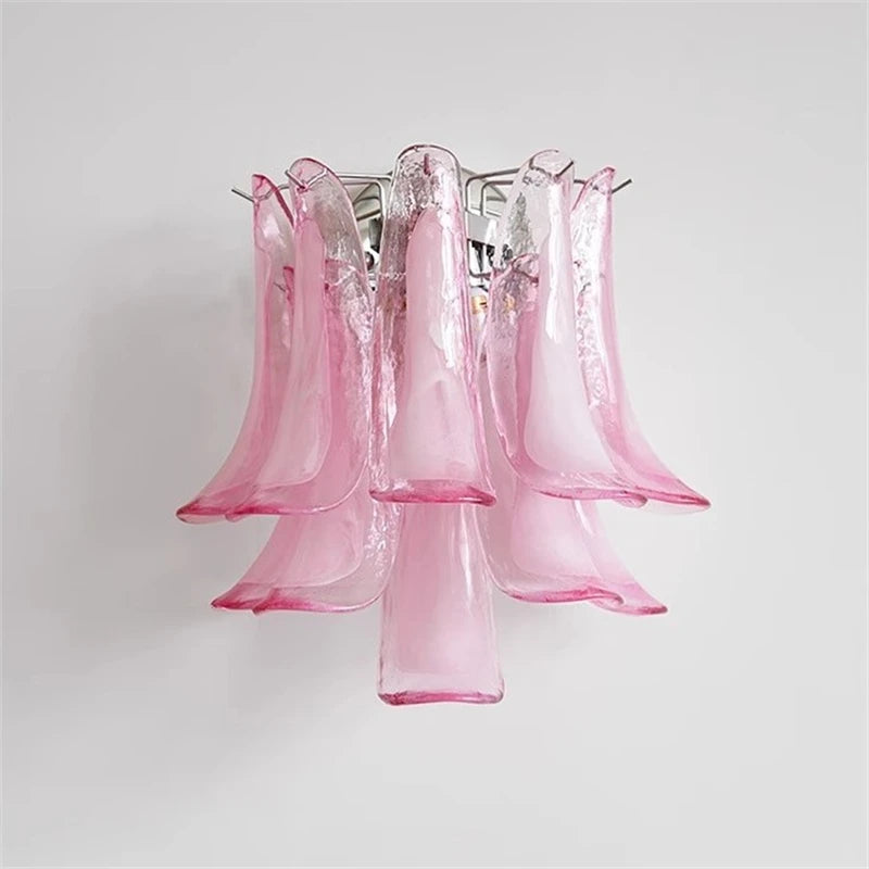 Close-up of a pink Murano glass petal wall sconce, showcasing the glass texture and chrome frame.