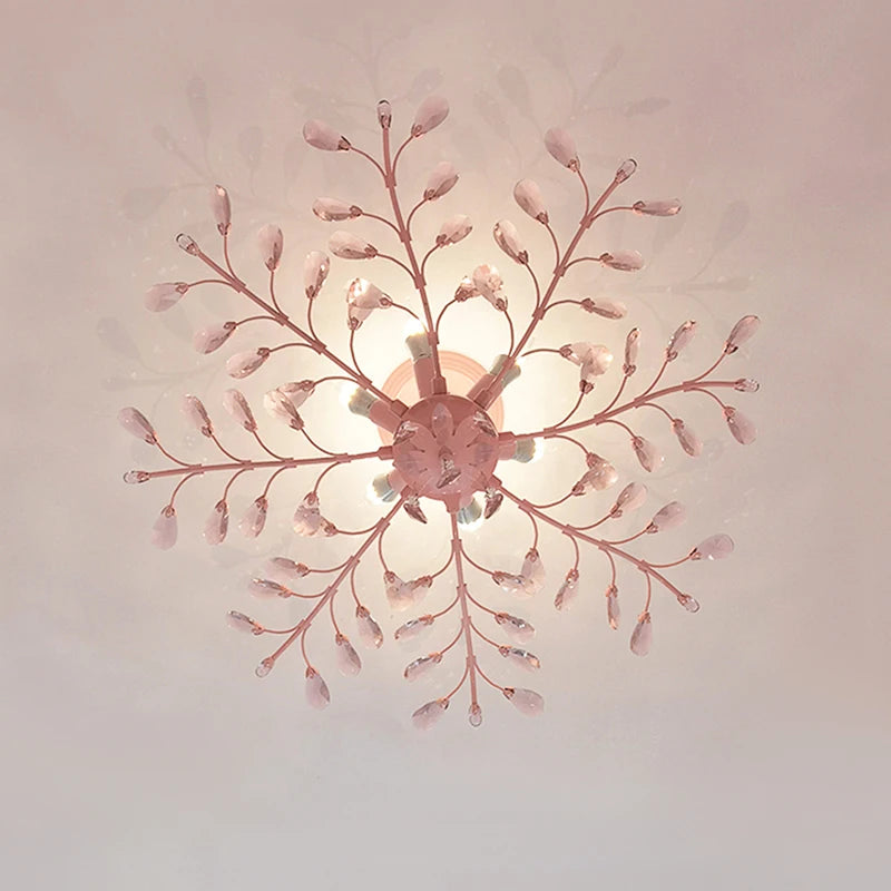 Overhead view of a pink floral semi-flush ceiling light with crystal accents, showing its radial design.
