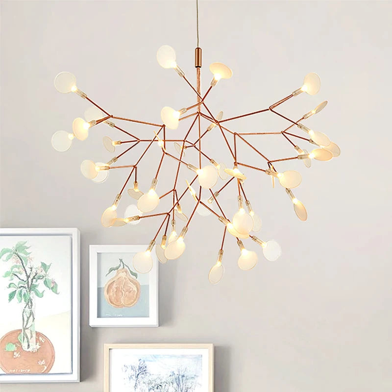 Modern chandelier with multiple light bulbs on a gray wall background