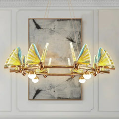 Gold ring chandelier with translucent yellow and blue butterfly-shaped shades and globe lights.