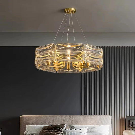 Close-up view of a gold and crystal chandelier with stacked cube-shaped crystals, showcasing the intricate design.