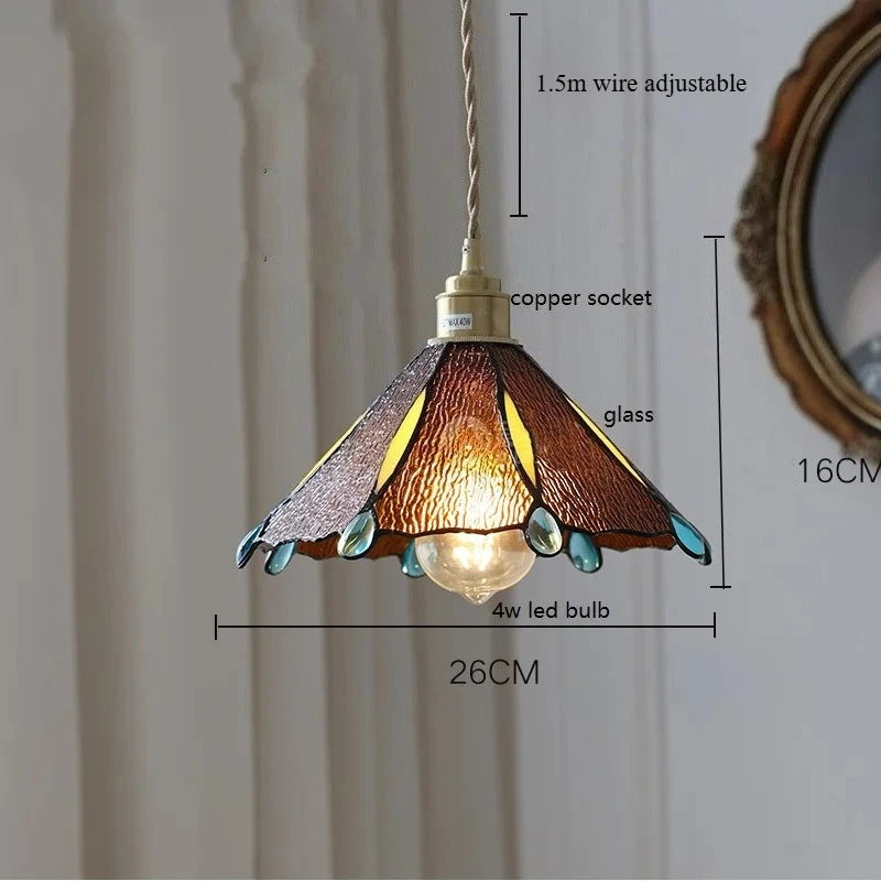 Pendant light with stained glass shade and measurements on a neutral background