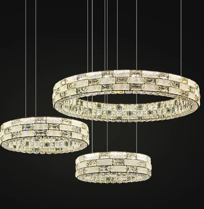 Crystal chandelier with three circular rings on a black background