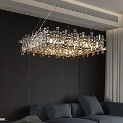 Close-up of the polished chrome chandelier, showcasing the detailed arrangement of crystal elements and the reflective chrome frame.