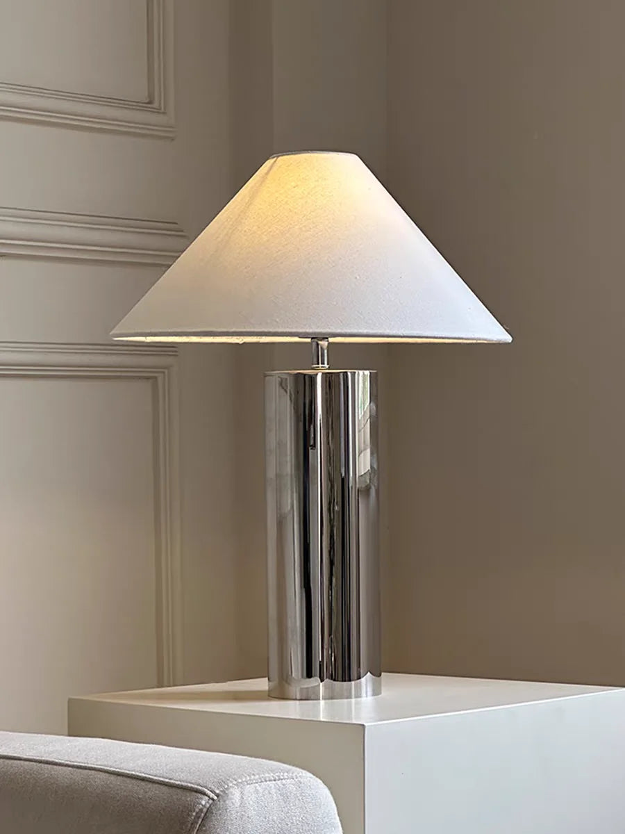 Table lamp with a white shade on a neutral background