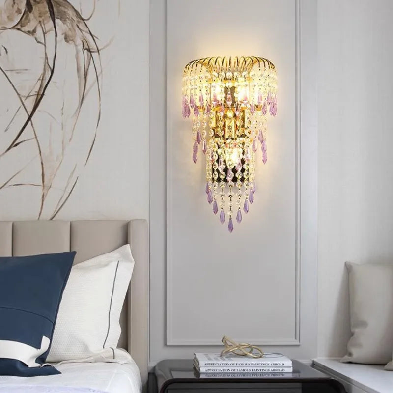 Decorative wall sconce with crystals in a bedroom setting