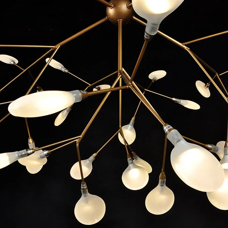 Modern chandelier with multiple light bulbs on a black background