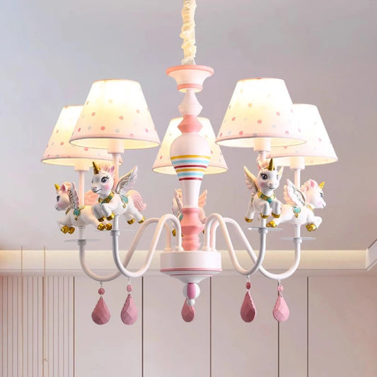 Close-up of the pink and white unicorn chandelier, showcasing unicorn details and polka dot shades.