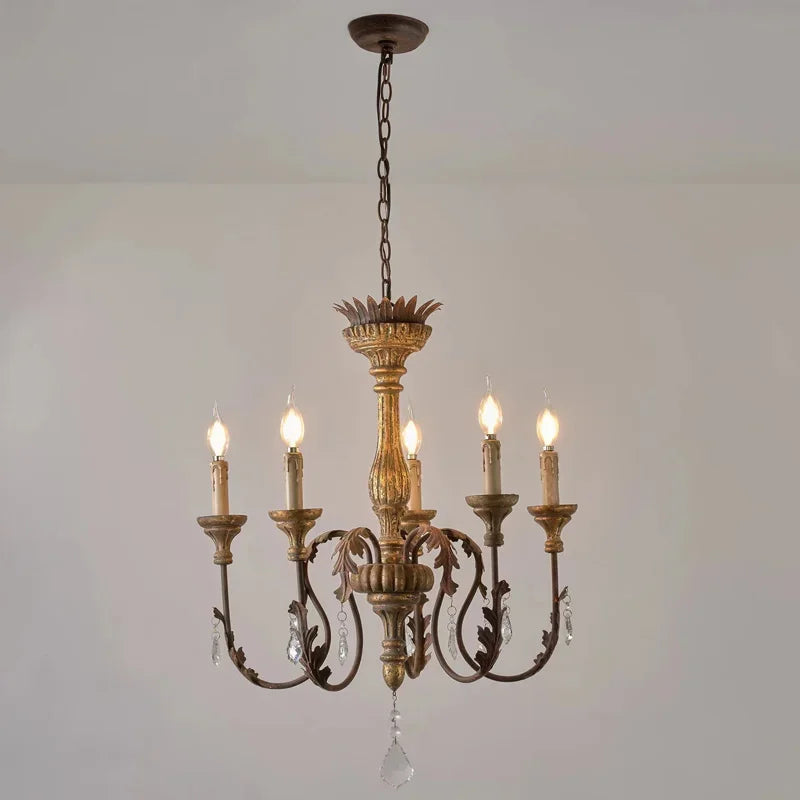 Decorative chandelier with five lights on a plain background