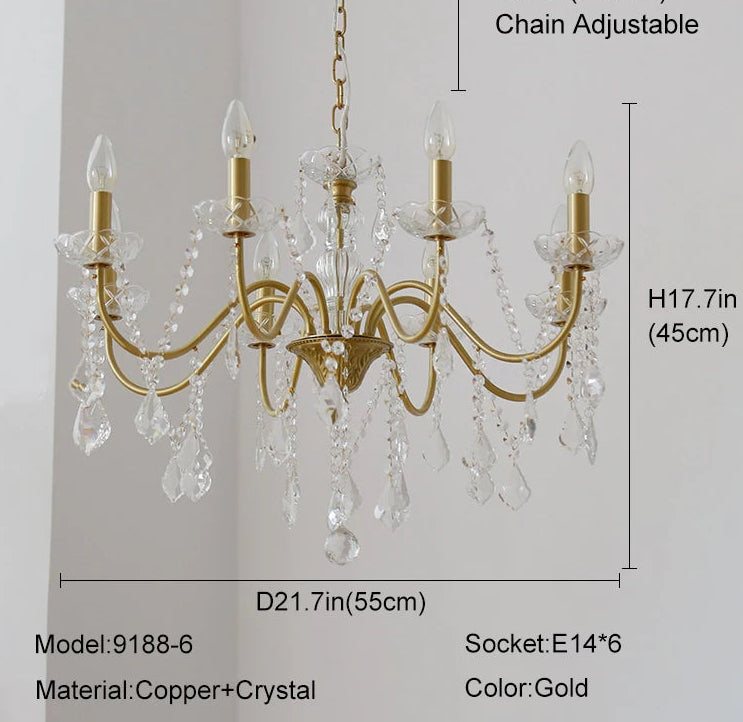 Gold chandelier with crystal accents and dimensions on a light gray background
