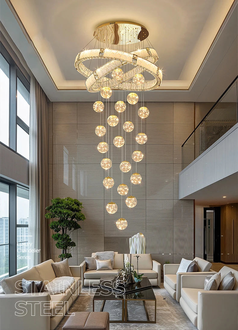 Modern living room with a large chandelier, gray walls, and beige furniture.