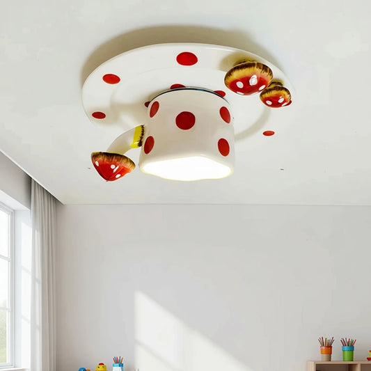 White ceramic ceiling light with red polka dots shaped like a coffee cup and mushrooms, mounted on a white ceiling.
