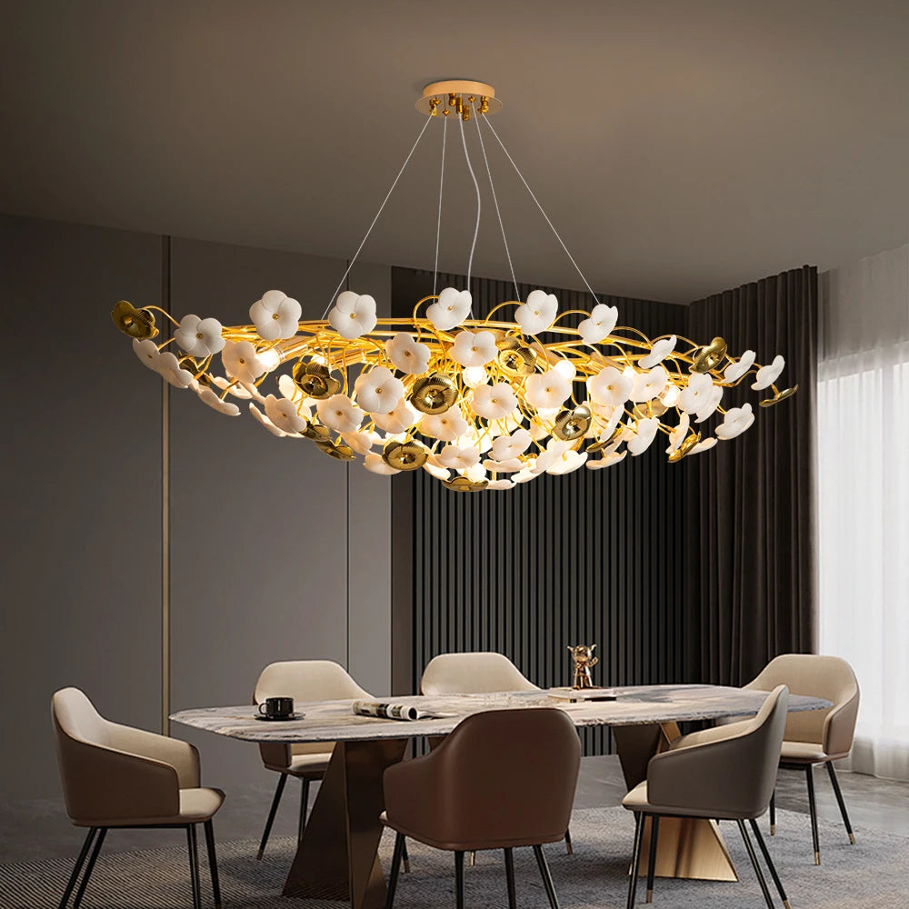 Luxury chandelier hanging above a dining table in a modern room.