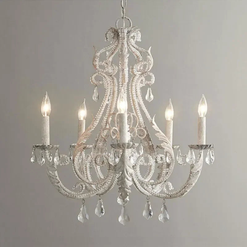 Decorative chandelier with crystal accents on a plain background