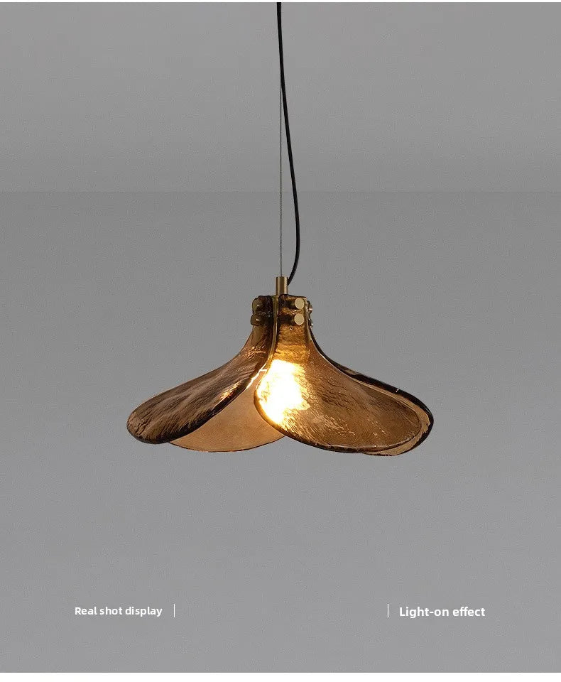 Gold pendant light on a gray background