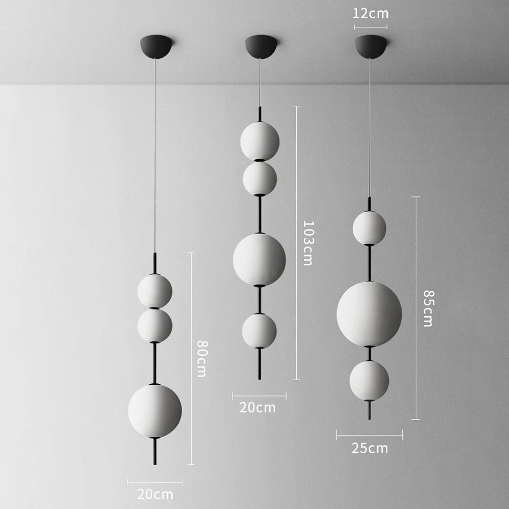 Modern pendant light with spherical design and measurements on a gray background