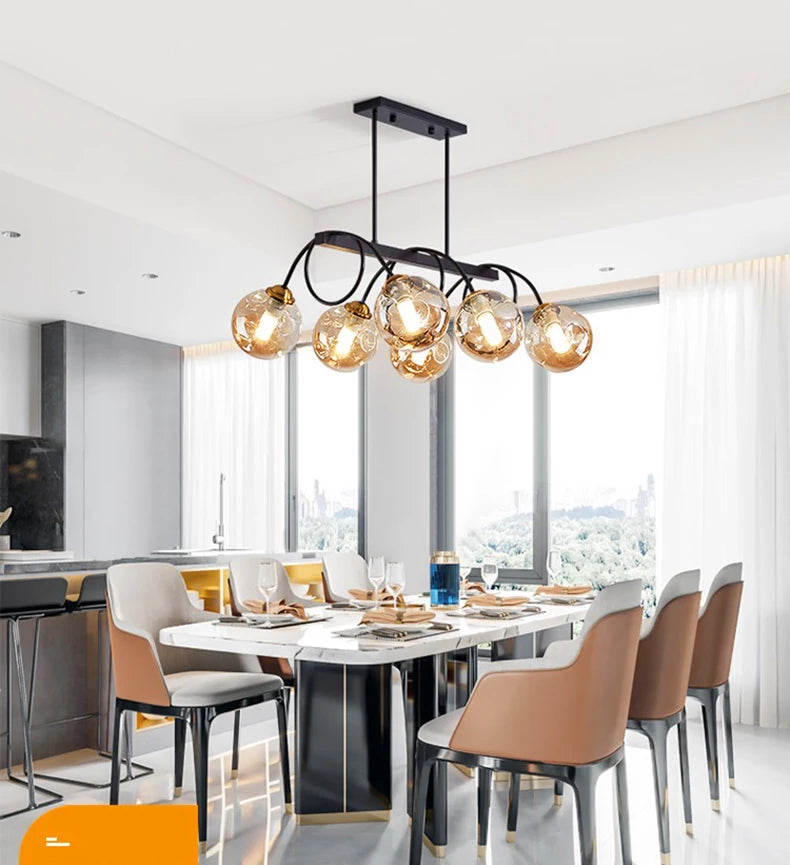 Modern dining room with a chandelier and table set for dinner.