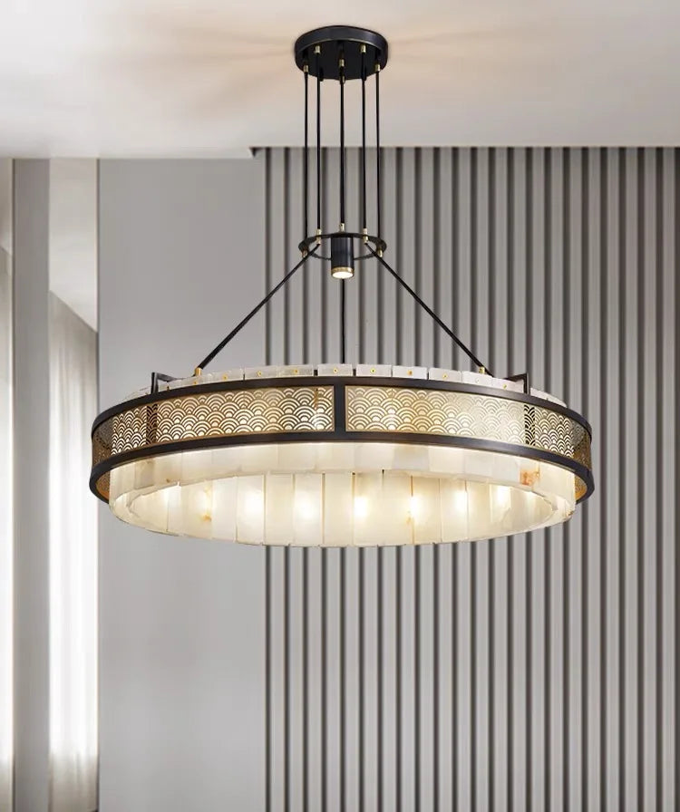 Modern chandelier hanging in a room with striped wallpaper