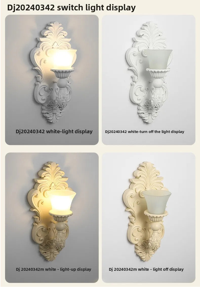 White wall lamp with ornate scrollwork and a faux candle light, shown on and off.