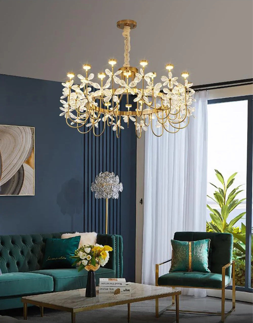 Luxurious chandelier in a living room with green sofa and decorative elements.