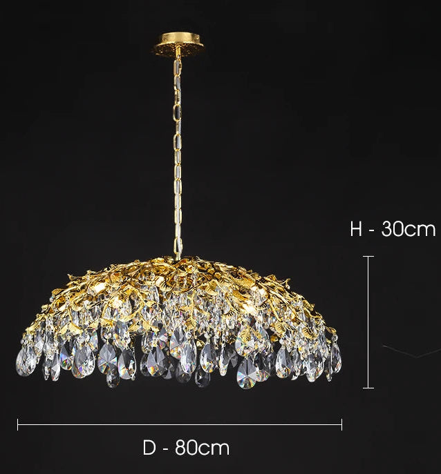 Gold chandelier with crystal details on a black background