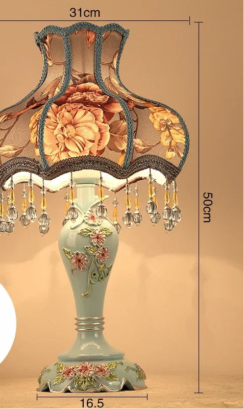 Decorative table lamp with floral design and measurements on a beige background