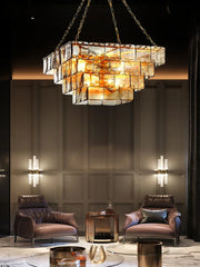 Close-up of a multi-tiered glass and gold chandelier showcasing its detailed construction.