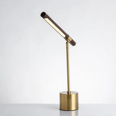 Side view of a brass and wood LED desk lamp, showing its adjustable angled light bar.