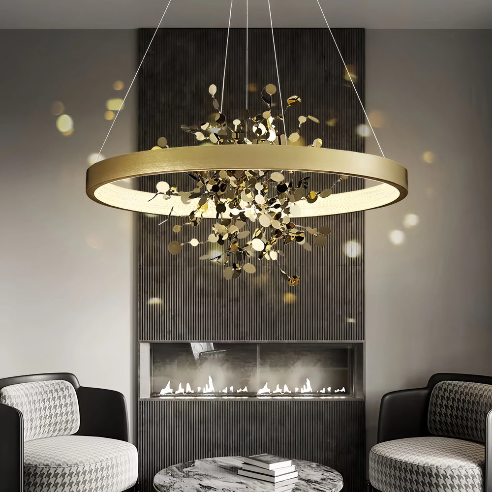 Gold ring pendant light with floral accents installed in a living room setting.