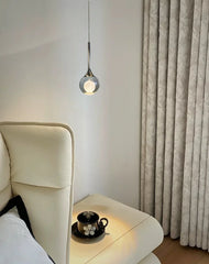 Glass Globe Pendant Light with Textured Moon Detail