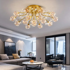 Living room with a gold floral crystal chandelier mounted on the ceiling above a sofa