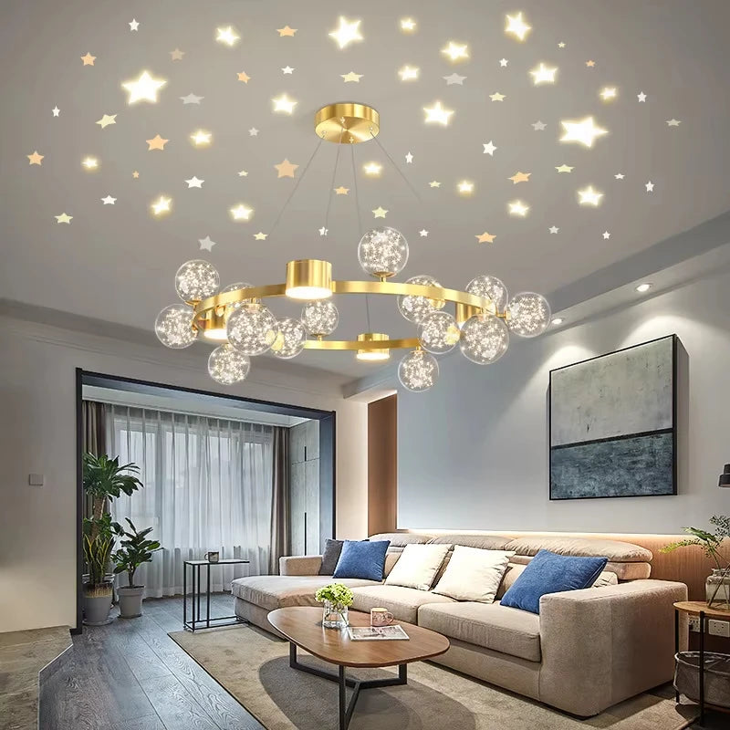 A close-up of a gold starburst chandelier with crystal-filled glass orbs, showcasing its intricate design above a sectional sofa.