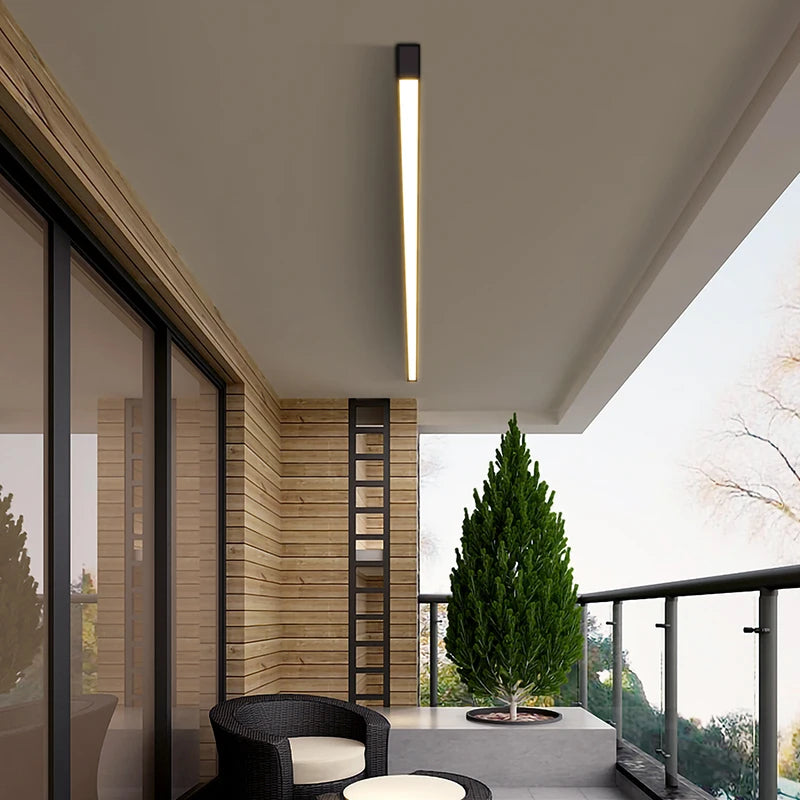 White linear bar ceiling light fixture installed in a balcony setting.