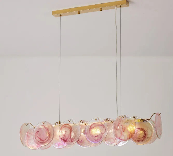 Chandelier with pink glass shades on a white background