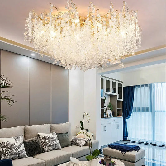 Close-up of the intricate gold frame and crystal accents on the floral chandelier.