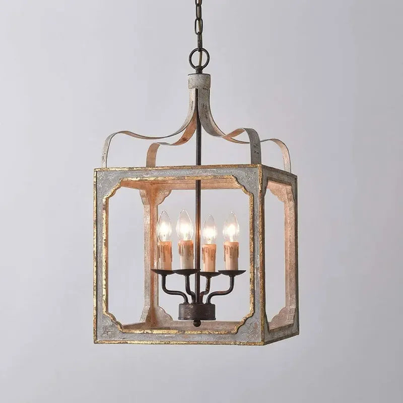 Distressed gray and gold lantern chandelier with four candelabra bulbs, shown against a white background.