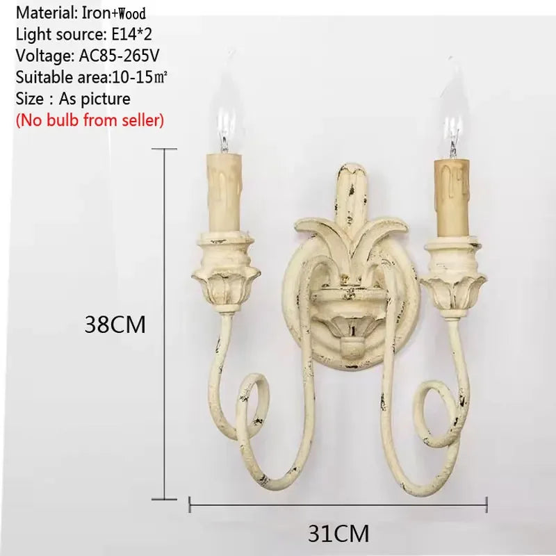 Decorative wall sconce with dimensions on a white background
