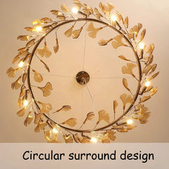 Top-down view of the circular surround design of the gold leaf chandelier.