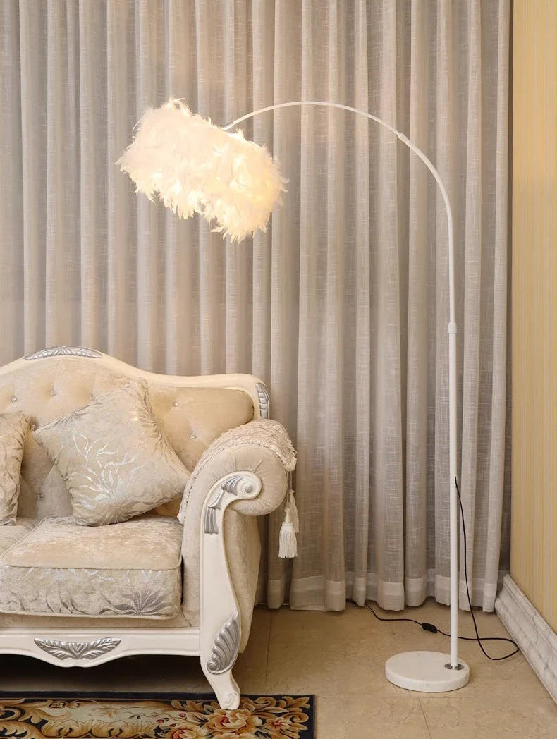 Decorative floor lamp next to a plush sofa in a room with curtains.