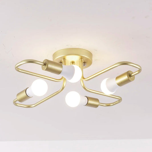 Gold metal starburst semi-flush ceiling light fixture with four exposed LED bulbs