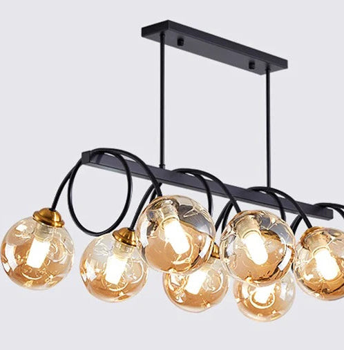 Modern chandelier with multiple round glass bulbs on a light gray background