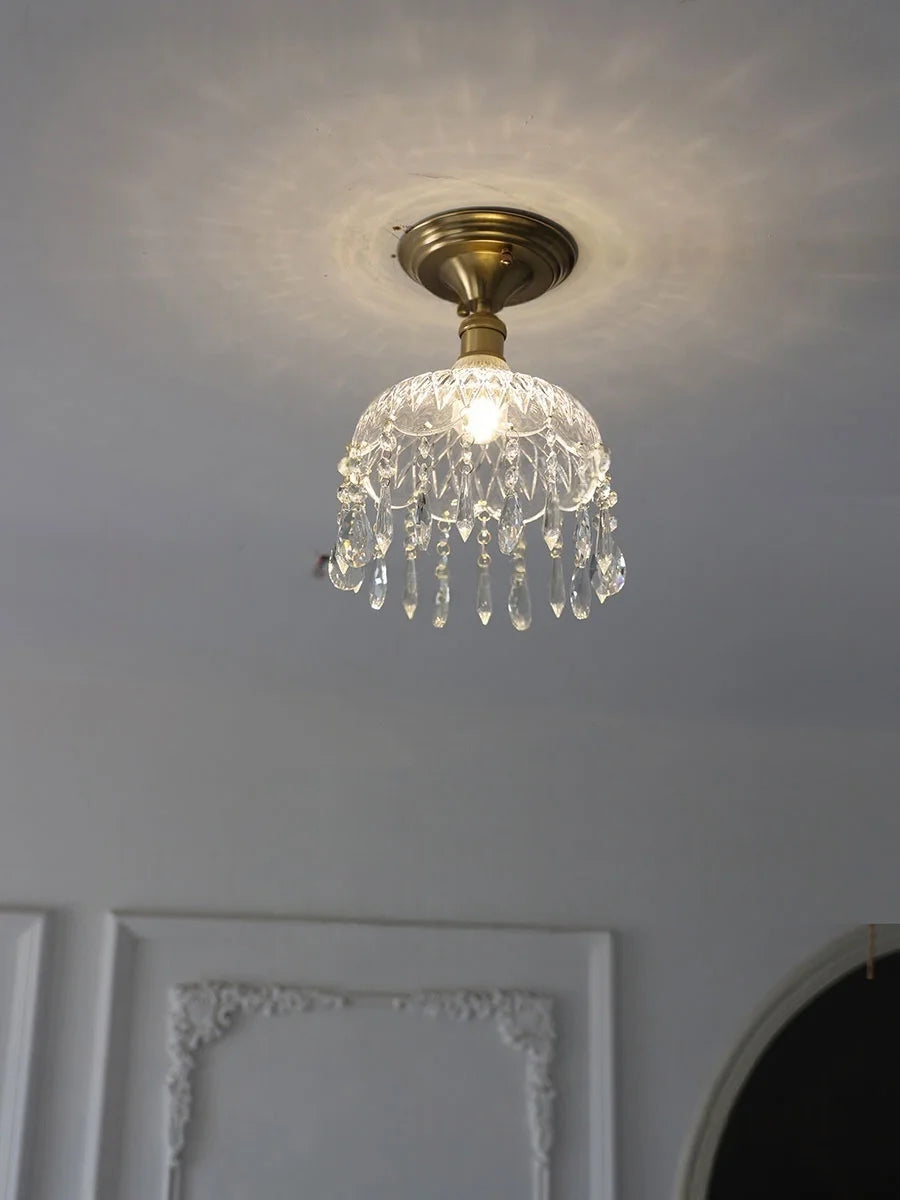 Crystal chandelier light fixture on a ceiling