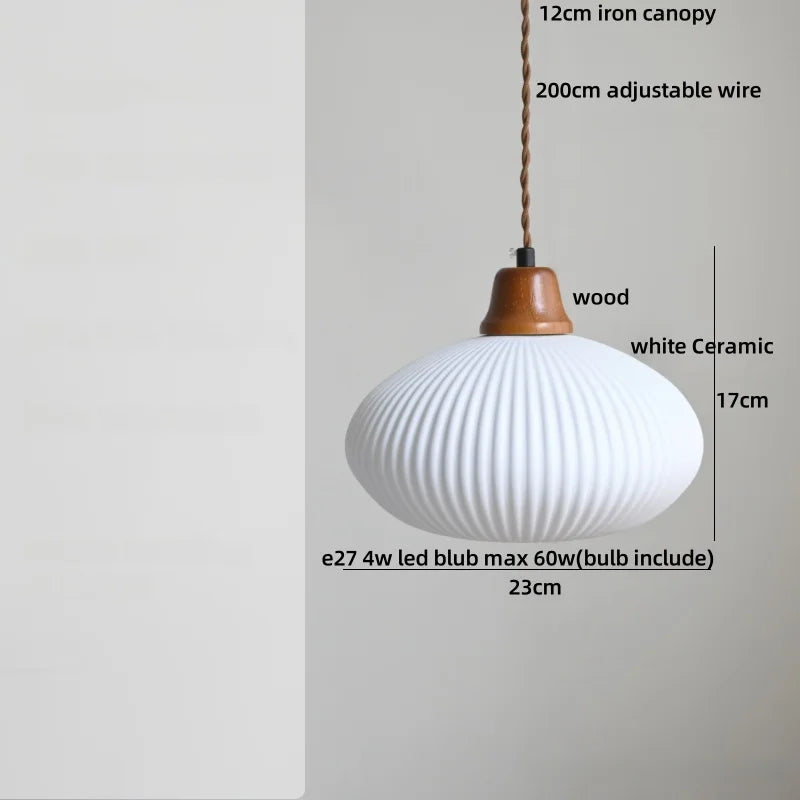 White ceramic pendant light with wooden canopy on a gray background