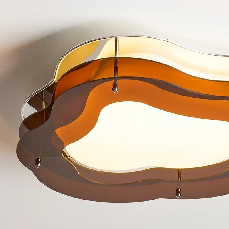 Ceiling light fixture with wavy design on a white background