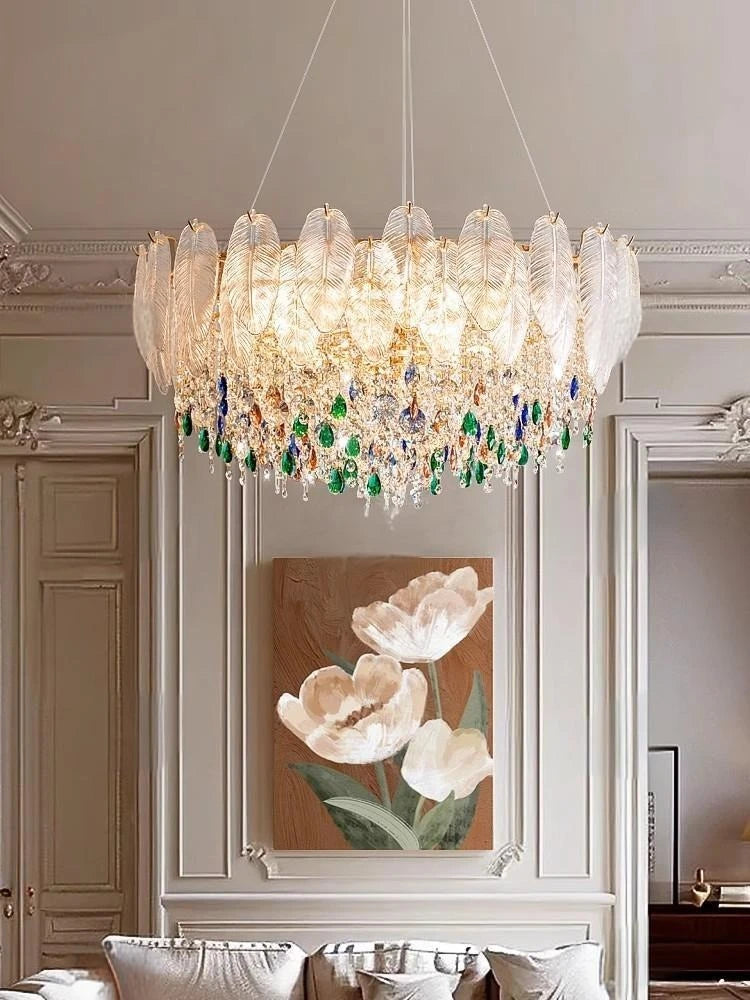Luxurious chandelier hanging in a room with decorative wall art