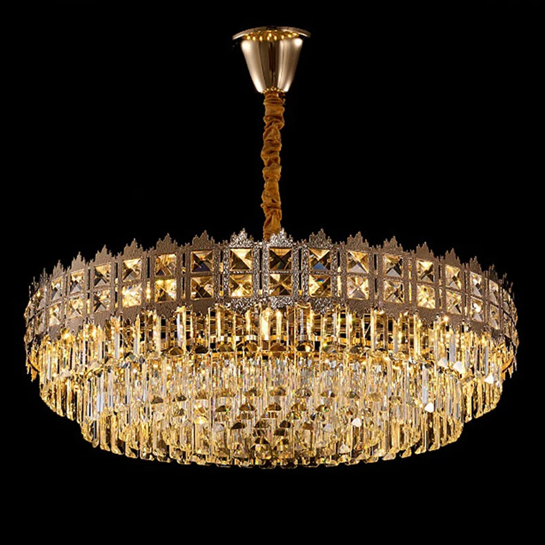 Gold chandelier with crystal accents on a black background