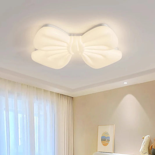 Close-up of a white bow-shaped LED flush mount ceiling light