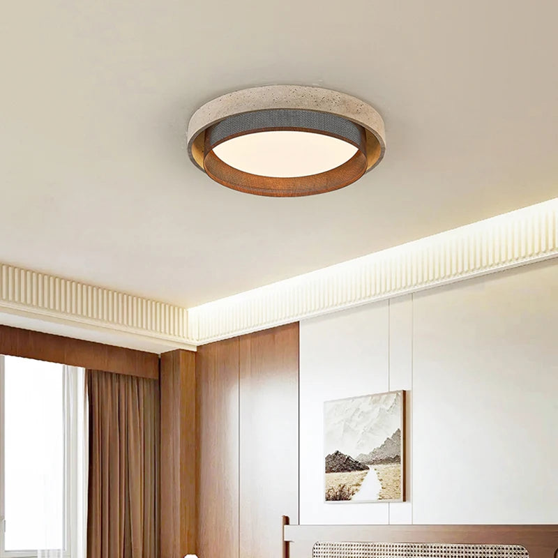 View of a room with a stone-textured ring flush mount ceiling light installed on the ceiling, showcasing its design.