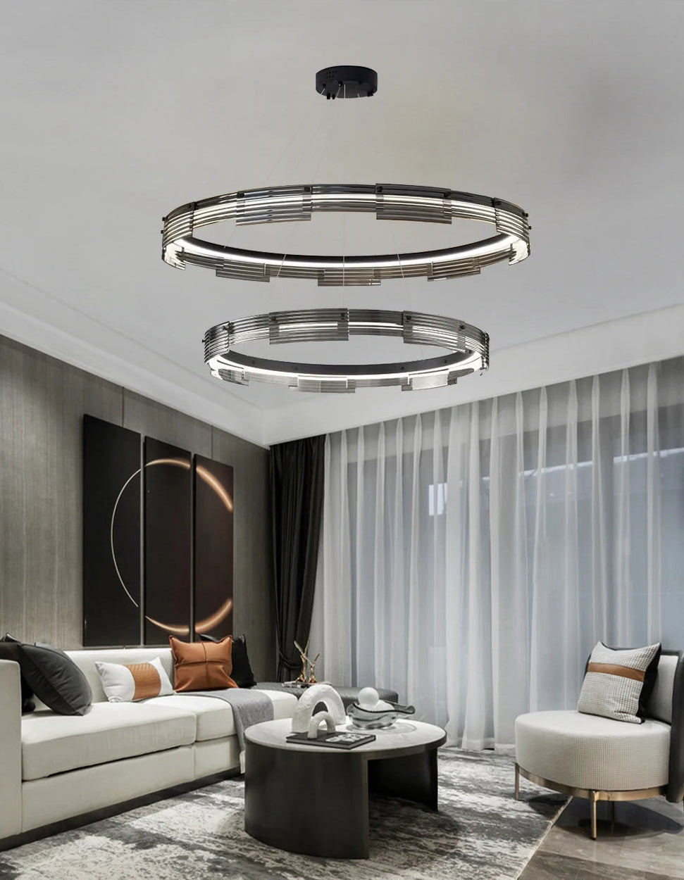 Modern living room with a stylish chandelier and decor elements.