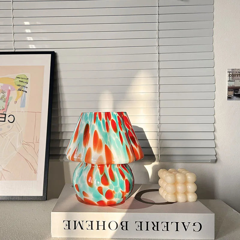 Colorful lamp on a white surface with a blurred background